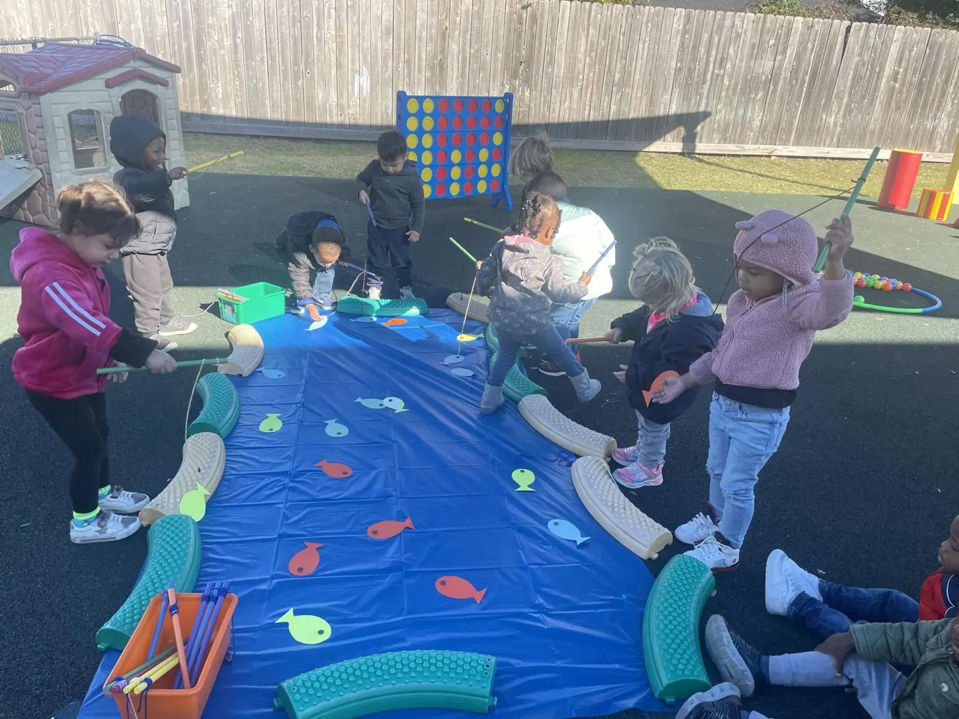 Fishing for letters and colors on the playground
