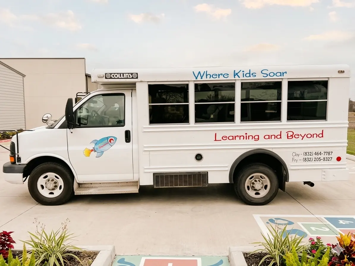 Learning & Beyond school bus with 'Where Kids Soar' lettering